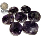 Sammelbild von 7 Amethyst Scheibensteinen mit einer 2Euro Münze als Größenvergleich